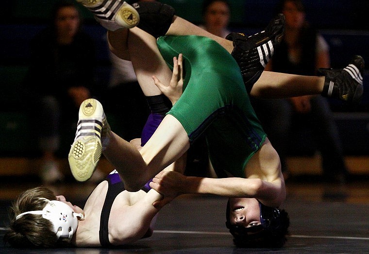 Glacier's Kaleb Mitchell (right) keeps his eyes on Butte's Jarret Rowling as the two attempt to gain control in a 98-pound match. Mitchell won by major decision.