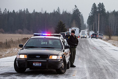 &lt;p&gt;A Kootenai County Sheriff&#146;s deputy keeps an eye on traffic as Bunco Road opens up following a manhunt that began with a high speed chase in the early morning hours.&lt;/p&gt;