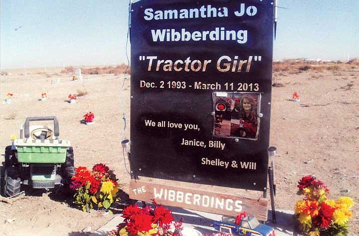 'Tractor girl' Samantha Wibberding is remembered with flowers at her gravesite.