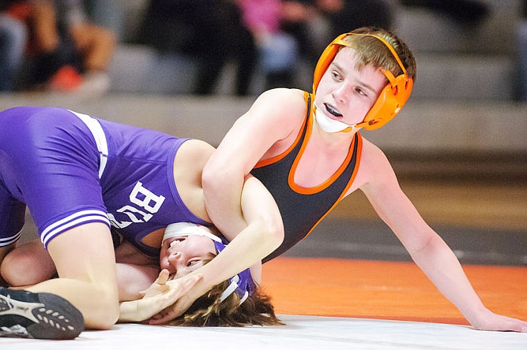 &lt;p&gt;Flathead&#146;s Hunter Rush (right) looks to his bench for advice as he tries to pin Butte&#146;s Tyler Casey Friday afternoon during a wrestling dual at Flathead High School. Rush won the 98-pound match by a technical fall, 18-2. (Patrick Cote/Daily Inter Lake)&lt;/p&gt;