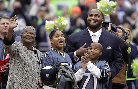 &lt;p&gt;Former Seattle Seahawks defensive tackle Walter Jones, right, puts his hand over his heart as he watches the unveiling of his now-retired jersey number with family members during a ceremony in the first half Sunday in Seattle.&lt;/p&gt;