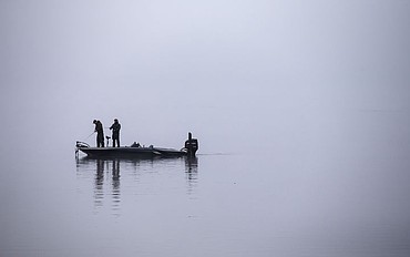<p>LOREN BENOIT/Press Two men fish on a foggy Veterans Day morning on Lake Coeur d'Alene.</p>