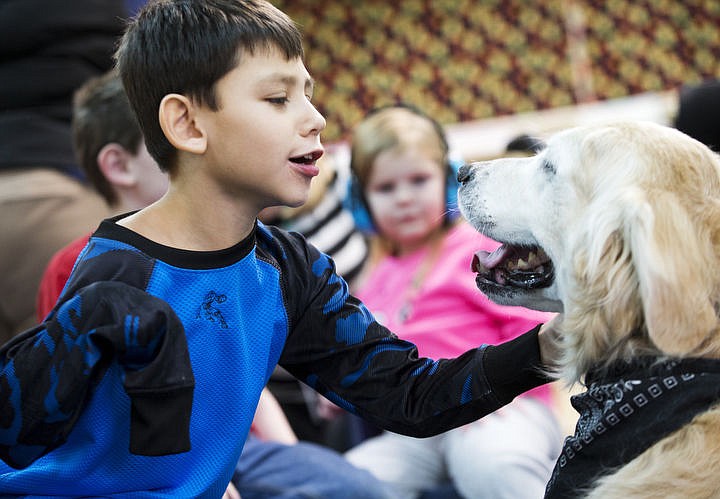 &lt;p&gt;LOREN BENOIT/Press Caden Bales strokes Rowdy's fur while at Fernan Elementary School on Tuesday.&lt;/p&gt;