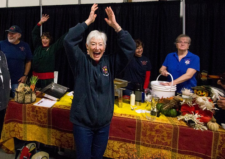 &lt;p&gt;Carlene Cada of the East Side Fire Protection District celebrates as the District is awarded the People's Choice Award for best soup at St. Vincent de Paul North Idaho's seventh-annual Souport the End of Homelessness fundraiser lunch on Thursday, Nov. 17, 2016 at the Kootenai County Fairgrounds. Forty businesses and non-profits donated soup for the lunch, where about 1,000 people attended and donated a total of $13,000 to Kootenai County warming shelters.&lt;/p&gt;