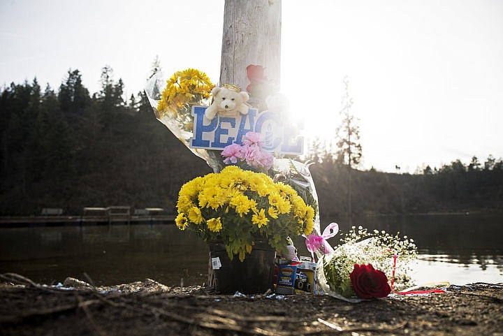 &lt;p&gt;LOREN BENOIT/Press Afternoon light shines on a bouquet of flowers next to a pole at the Fernan Lake boat launch on Monday in remembrance of Tristan Phelps, 1, Riley Phelps, 2, and Misty Phelps, who were found last Thursday morning inside a fully submerged car at the boat launch.&lt;/p&gt;