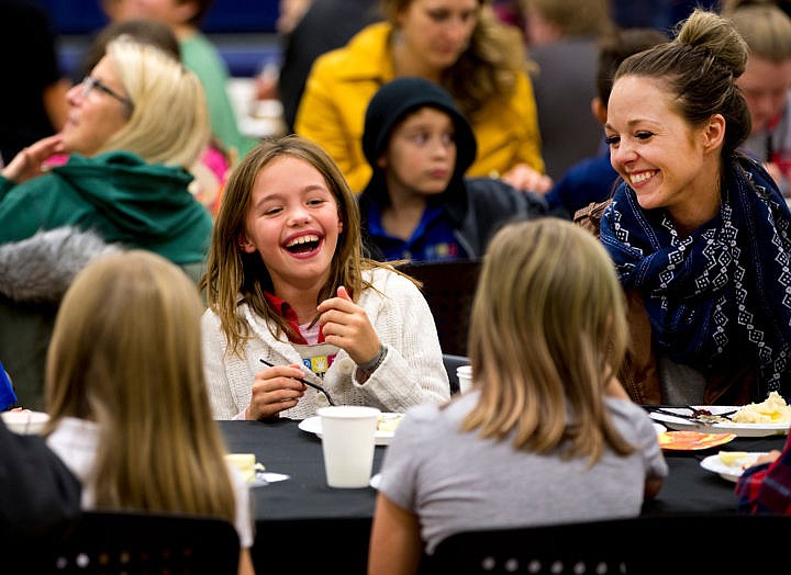 &lt;p&gt;Annabelle Taylor, 9, lets out a laugh along with Ashley Felder at the inaugural Thanksgiving Dinner on Thursday, Nov. 17, 2016 at the Lola and Duane Hagadone Boys and Girls Club. More than 400 people enjoyed the free meal.&lt;/p&gt;