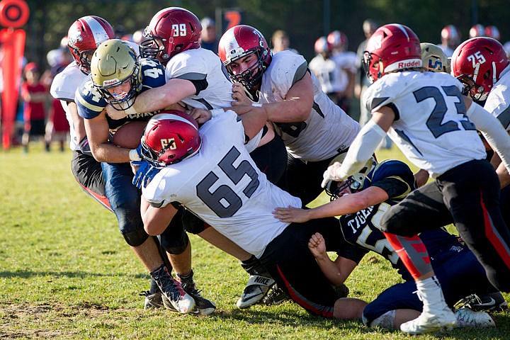 &lt;p&gt;Timberlake running back Caleb Munson (44) is eaten up in the backfield by a slew of Gooding players on Saturday, Nov. 5, 2016 at Timberlake High School.&lt;/p&gt;