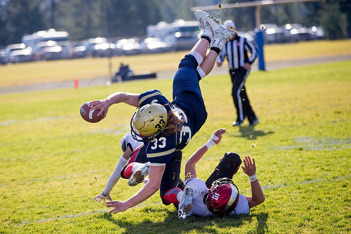 &lt;p&gt;Timberlake quarterback Brandon Hausladen (33) gets airborne after colliding with Brayden Roe (10) and Jayden Mullins of Gooding on Saturday, Nov. 5, 2016 at Timberlake High School.&lt;/p&gt;