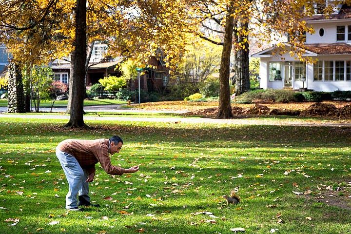 &lt;p&gt;Paul Parla of Coeur d'Alene holds an acorn out to a curious squirrel on Thursday, Nov. 3, 2016 at City Park in Coeur d'Alene.&lt;/p&gt;