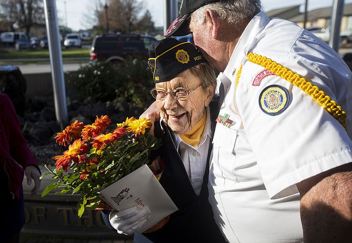 Dave Sheldon, with the Kootenai County Honor Guard, hugs 2016 Distinguished Veteran Margaret Ogram of Post Falls Post 143 American Legion after the City of Hayden's Veterans Day ceremony Friday, Nov. 11, 2016.