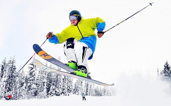 Paul Kozuch flies through the air on his skis during opening day at Whitefish Mountain Resort at Big Mountain. A settled base of about 50 inches of snow is sitting at the mountain's summit.