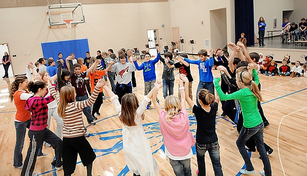 Fifth and sixth graders at Cayuse Prairie School rehearse their song "Hallelujah" for the Cayuse Christmas Program on Friday afternoon. The Christmas Program, Tuesday night at 7 p.m. will be the first performance to take place in the new gymnasium.