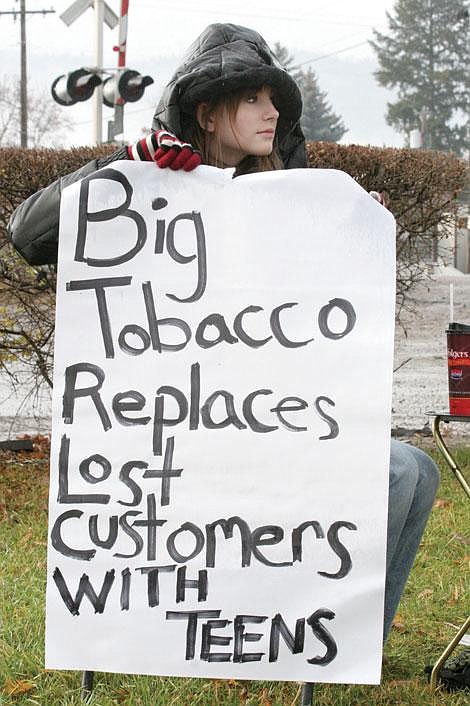 Photo by Sarah Leavenworth&lt;br&gt;Bambi Erving of Plains braves the elements last month to hold a silent protest against big tobacco companies targeting teenagers.