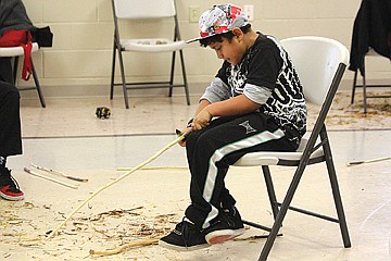 &lt;p class=&quot;p1&quot;&gt;Autahi Leonard, 9, carves his own double ball stick.&#160;&lt;/p&gt;