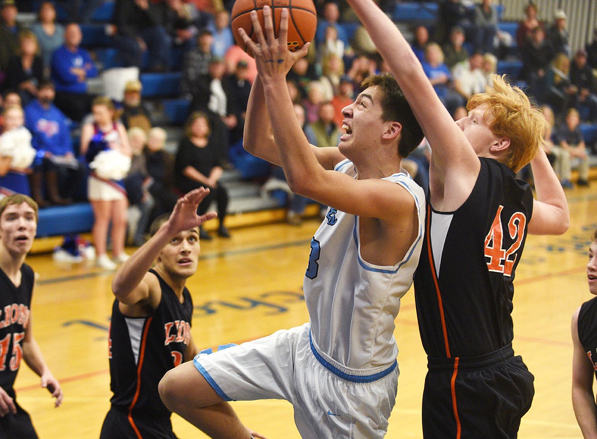 &lt;p&gt;Bigfork center Beau Santistevan drives past Eureka's Jake Cardinale during the first quarter of the Vikings' 53-29 victory in Bigfork on Tuesday. (Aaric Bryan/Daily Inter Lake)&lt;/p&gt;