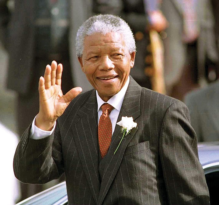 South African President Nelson Mandela makes his way to Parliament in Cape Town, South Africa, in this May 9, 1994, file photo. Mandela died on Dec. 5.