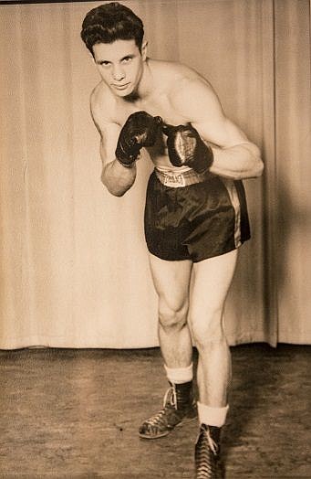 <p> In this 1947 photo, Bob Eachon poses for a portrait marking his move into professional boxing. Eachon boxed in high school and during his time in the military in WWII.</p>