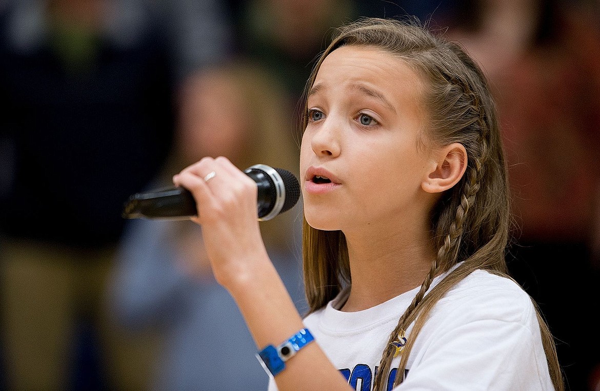 &lt;p&gt;Dalton Elementary School fourth grader Payton Smith sings the National Anthem before the start of a Coeur d'Alene and Eastmont High School boys basketball game on Saturday at Coeur d'Alene High School.&lt;/p&gt;