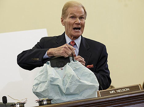 &lt;p&gt;Senate Commerce Committee member Sen. Bill Nelson, D-Fla. displays the parts and function of a defective airbag made by Takata of Japan that has been linked to multiple deaths and injuries in cars driven in the US, during the committee's hearing on Capitol Hill in Washington on Nov. 20.&#160;&lt;/p&gt;