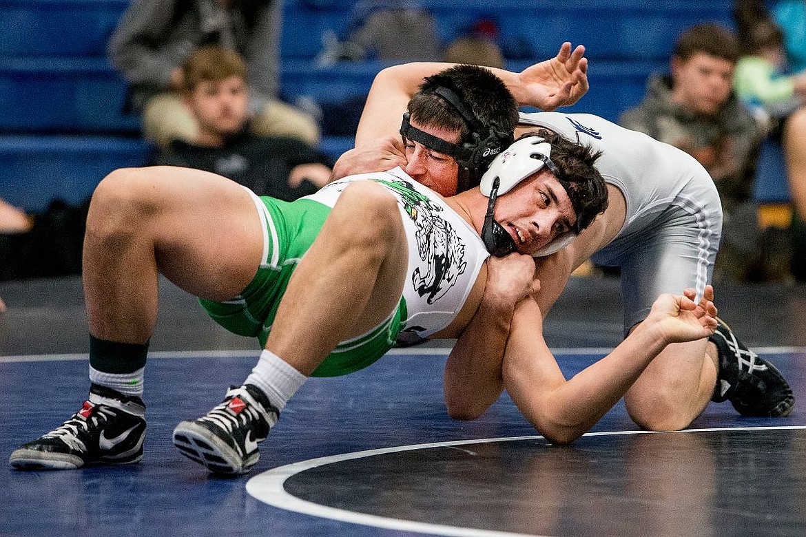 &lt;p&gt;JAKE PARRISH/Press Lake City's Nate Lambert, top, fights to gain control over East Valley's Brenten Goodwater on Monday at Coeur d'Alene High School. Lambert defeated Goodwater.&lt;/p&gt;