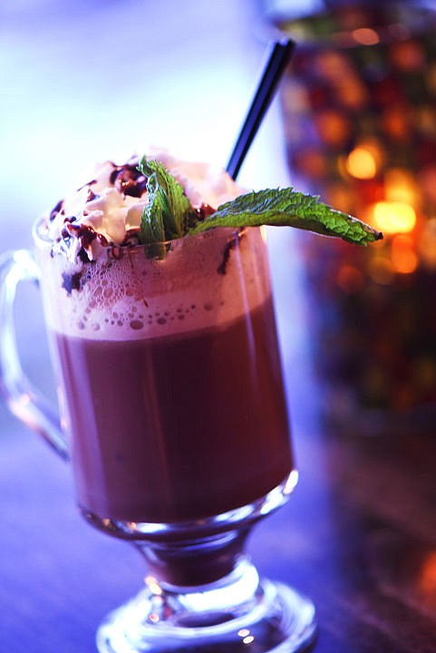 <p>THE HUCKLEBERRY Hot Chocolate at The Lodge at Whitefish Lake is made with huckleberry vodka, hot chocolate, whipped cream, chocolate sauce and topped with a mint leaf. (Brenda Ahearn/This Week in the Flathead)</p>