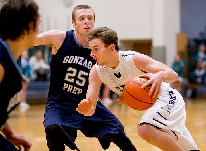 &lt;p&gt;Lake City's Nathan Hartz drives to the basket as Gonzaga Prep's Logan Adams watches on Tuesday at Lake City High School.&lt;/p&gt;
