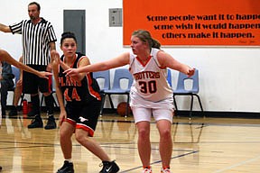 Kayla Revier boxes out Franky Winebrenner during a free-throw attempt at the Orange and Black scrimmage.