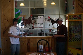 Taylor Firestone and Wade Bache showed their artistic ability by painting a pair of horses inside Stageline Pizza.
