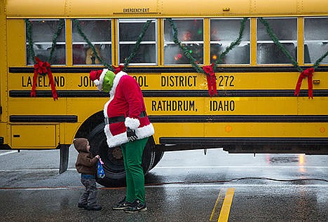 &lt;p&gt;Conrad Funderburg, 2, visits with the Grinch at the December D&#146;Lights Winter Festival in Rathdrum on Saturday afternoon. The event featured a bus with Santa, tree lighting ceremonies, hayrides, and activities for kids.&lt;/p&gt;