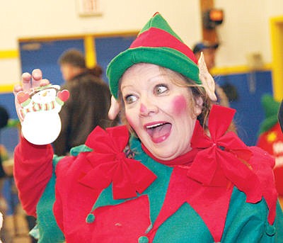 &lt;p&gt;One of Santa's helpers Cynthia Curtiss as the head elf.&lt;/p&gt;