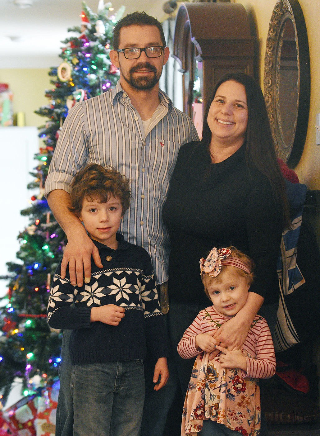 <p>Brad and Mandy Briney stand with their children Elliott and Thelma Mae at their home in Kalispell. (Aaric Bryan/Daily Inter Lake)</p>