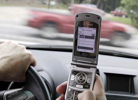 &lt;p&gt;In this Sept. 20 photo, a phone is held in a car in Brunswick, Maine. Texting while driving increased 50 percent last year and two out of 10 drivers say they've sent text messages or emails while behind the wheel despite a rush by states to ban the practice, the National Traffic Safety Administration said Thursday.&lt;/p&gt;