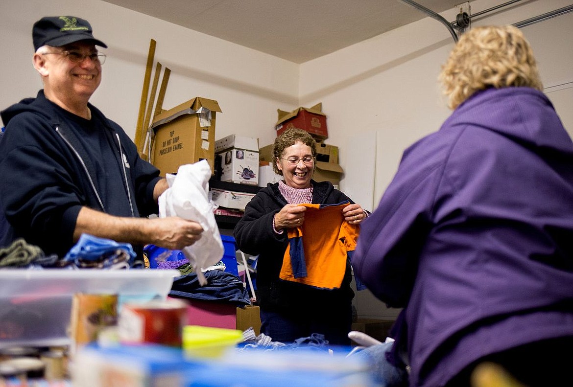 &lt;p&gt;From left to right, veteran Jack Drapau, Pam Moist and Mary Matthews sort donated clothes in the drop-off area of the Newby-ginnings veterans center thrift store on Tuesday in Dalton Gardens.&lt;/p&gt;