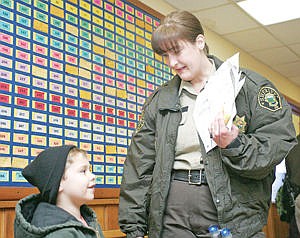 &lt;p&gt;Talon Miguel, left, gets acquainted with his shopping partner Deputy Cathy Ruddock during Shop With a Cop day Thursday at Libby Elementary.&lt;/p&gt;