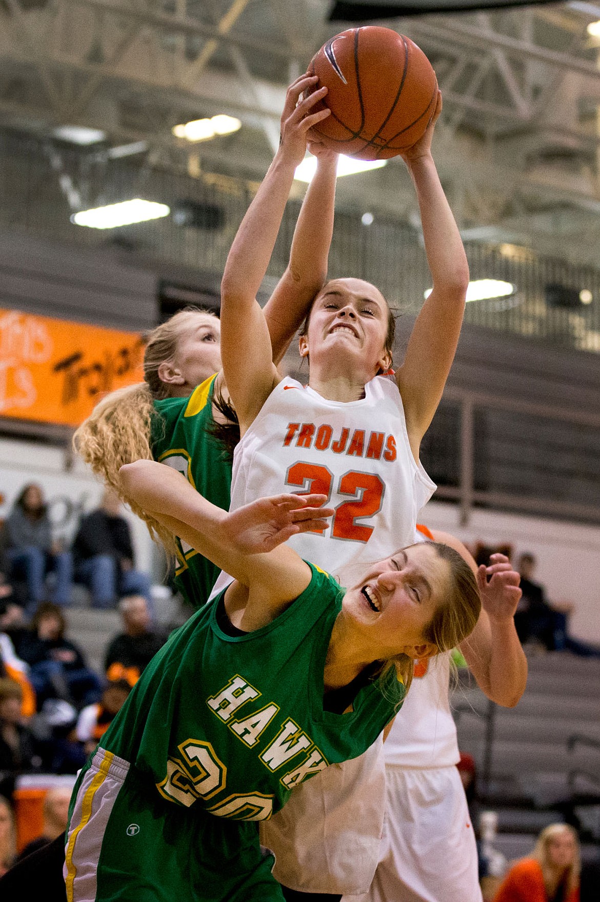 &lt;p&gt;JAKE PARRISH/Press Post Falls' Jacksen McCliment-Call (22) maintains control of a rebound over Taylor Elpers (20) and Heidi Boyer (42) of Lakeland on Thursday at Post Falls High School.&lt;/p&gt;