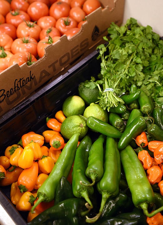 <p>Fresh vegetables laid out and ready to be chopped and prepped by Daniel Erickson on Friday morning, December 9, in the commercial kitchen at Sykes in Kalispell. The fresh ingredients go into his Blaine Mountain Salsa which is available for sale in the Sykes grocery store. (Brenda Ahearn/Daily Inter Lake)</p>