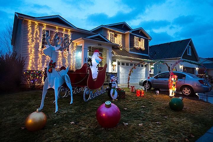 &lt;p&gt;TESS FREEMAN/Press Wayne and Rita Anderson light up Yaquina Drive with their Christmas display featuring dozens of candy canes, penguins and Olaf, the snowman from &#145;Frozen.&#146;&lt;/p&gt;