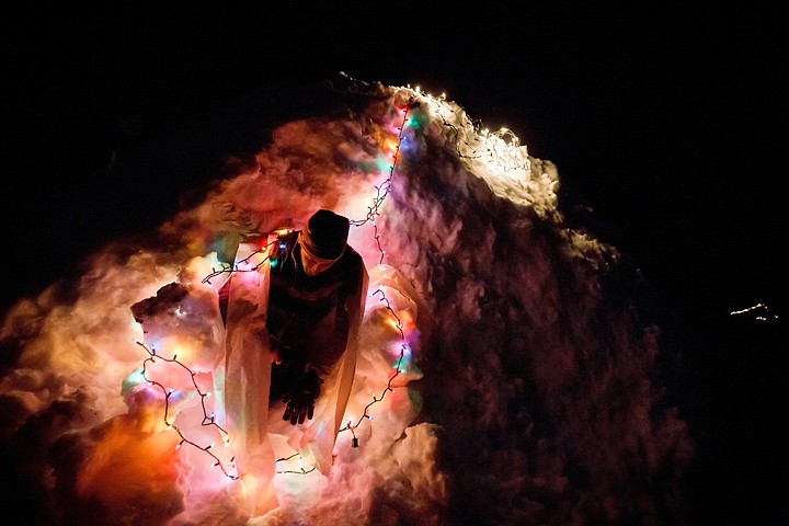 &lt;p&gt;Joe Roberts crawls out of his 10-foot-tall igloo he built in his backyard and decorated with strands of lights.&lt;/p&gt;