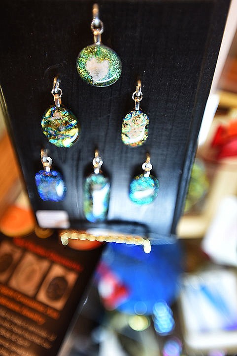 <p>Jewelry by Ann Schmidt of Red Voodoo Glass on display at Paint, Metal and Mud Art Gallery in downtown Kalispell. </p>