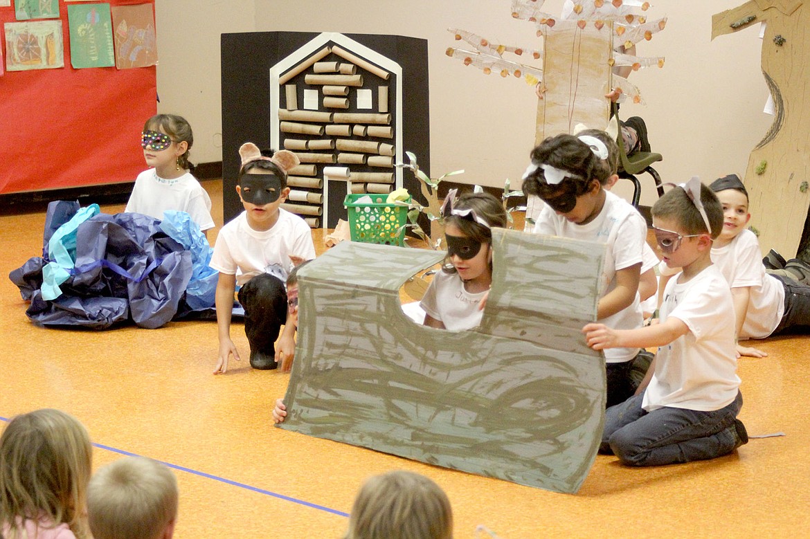 &lt;p&gt;&lt;strong&gt;A young grizzly bear talks to some raccoons living in a fallen tree as he tries to find where he belongs. The play was one of two created by the Plains second graders as part of their arts integration science curriculum.&lt;/strong&gt;&lt;/p&gt;