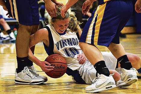&lt;p&gt;Coeur d'Alene's Caelyn Orlandi falls to the floor while going after the ball in the first half.&lt;/p&gt;