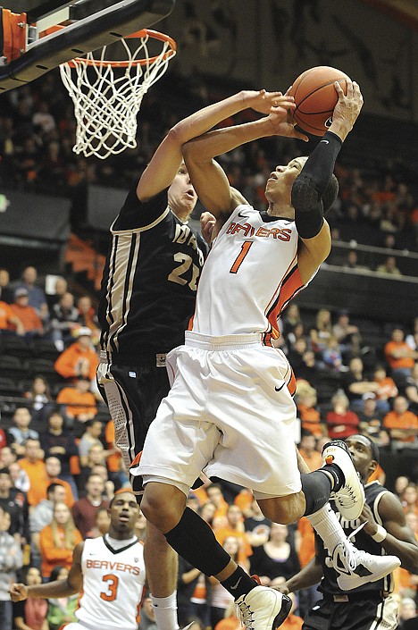 &lt;p&gt;Oregon State's Jared Cunningham (1) faces defensive pressure from Idaho's Matt Borton (20) in the first half Friday night in Corvallis, Ore.&lt;/p&gt;