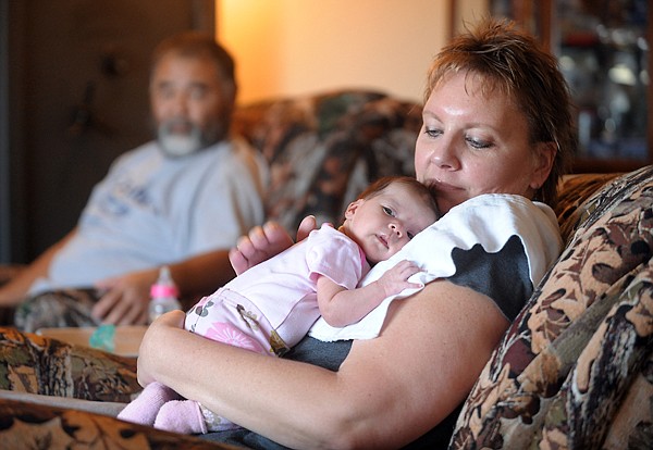 &lt;p&gt;Sherrie Sonoda holds her daughter Sophia on a recent morning at
her home in Kila. In the background, proud father Steve Sonoda
looks on. Sophia, shown at top in Sherrie&#146;s hands, was five weeks
old Nov. 29. The Sonodas, who had given up on the idea of being
parents, adopted Sophia in late October.&lt;/p&gt;