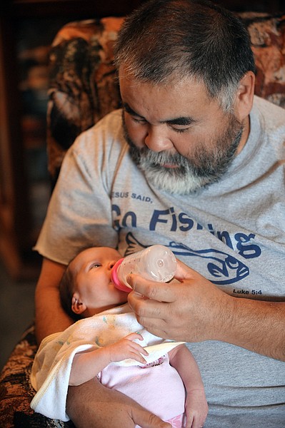 &lt;p&gt;Steve Sonoda looks down at his daughter, Sophia, as he feeds her
a bottle on a recent morning at his home in Kila. Sherrie Sonoda
says Sophia &#147;will be Daddy&#146;s little girl.&#148;&lt;/p&gt;