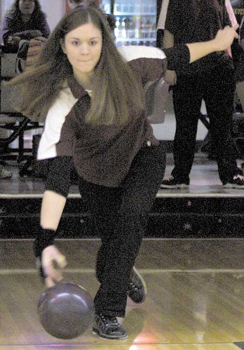 Senior Berlyn Davis bowled 22 points below her season average, but threw three consecutive strikes in final frame to help force a 2-2 split with Wenatchee.