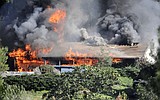 Explosives-laden house burns down