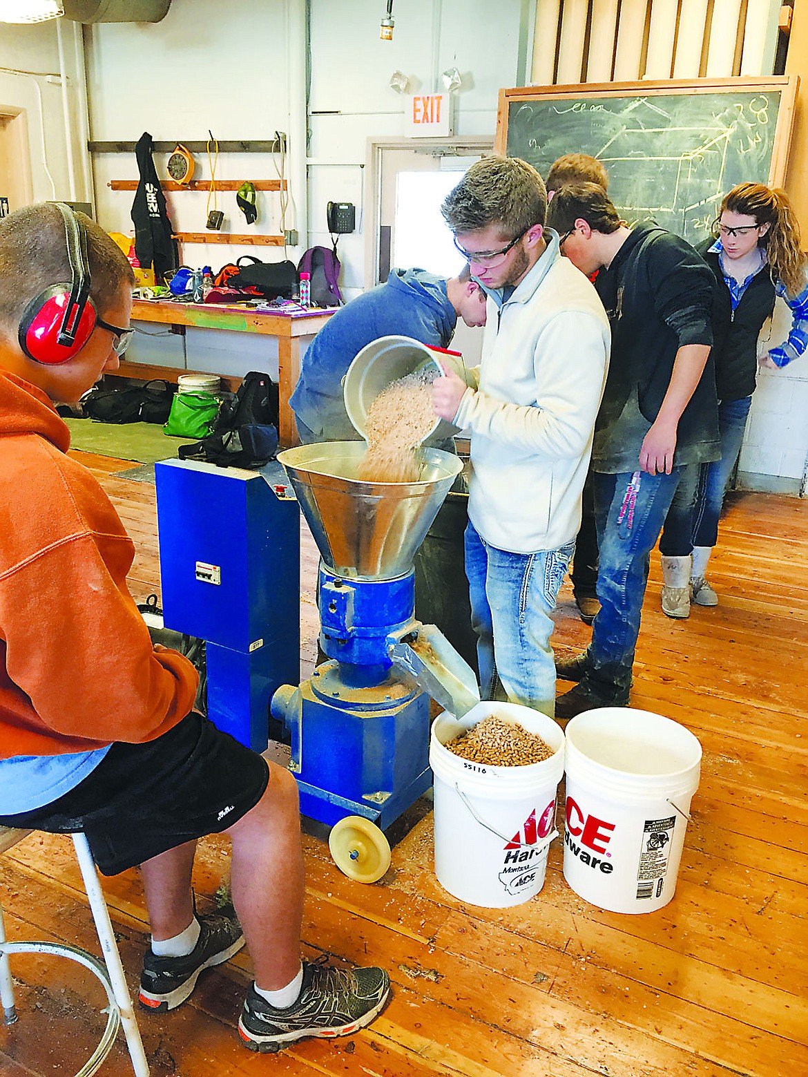 &lt;p&gt;Flathead High School Woods I student Avery Knoll runs the school's pelletizer while student Tucker Nadeau watches for quality control. Flathead woods and International Baccalaureate students are entering a new business and curriculum venture this year making, marketing and selling wood pellets using recycled materials.&lt;/p&gt;