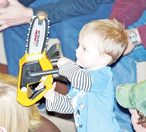 &lt;p&gt;Hudson Hannah revs his toy chainsaw, showing his Logger team spirit at the Bonners Ferry game.&lt;/p&gt;
