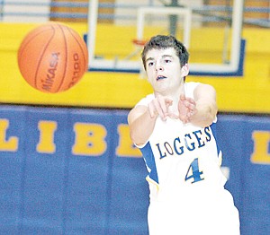 &lt;p&gt;Collin Johnson, sophomore guard, passes to Jared Winslow in the first quarter of play against Bonners Ferry. Libby held the Badgers to five points in the first quarter.&lt;/p&gt;