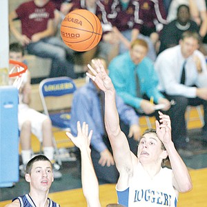 &lt;p&gt;Barak Lapka, senior forward, launches a shot in the third quarter against Bonners Ferry. Lapka had 10 points in the nailbiter.&lt;/p&gt;